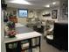 Finished basement with a craft/sewing area and storage, offering potential for various hobbies and organization at 12931 W Florida Dr, Lakewood, CO 80228