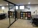 Finished basement featuring a craft area, mirrored closet, and natural light from windows at 12931 W Florida Dr, Lakewood, CO 80228