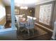 Warm dining room with natural light, hardwood floors, and a beautifully decorated quilt on the wall at 12931 W Florida Dr, Lakewood, CO 80228
