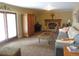 Inviting living room with a cozy stone fireplace, hardwood floors, and comfortable seating at 12931 W Florida Dr, Lakewood, CO 80228