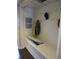 Functional mudroom features built-in bench with storage and wall-mounted hooks for organization at 12931 W Florida Dr, Lakewood, CO 80228