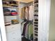Organized walk-in closet featuring shelving, hanging racks, and ample storage space for clothes and shoes at 12931 W Florida Dr, Lakewood, CO 80228