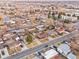 A picturesque aerial view displays a neighborhood of well-maintained homes and mature trees at 5116 Jellison St, Arvada, CO 80002