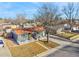 A captivating aerial view of a single-story home featuring a new roof and neatly landscaped surroundings at 5116 Jellison St, Arvada, CO 80002