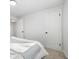 This bedroom offers a neutral palette, soft carpet, ample closet space and natural light at 5116 Jellison St, Arvada, CO 80002