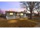 Charming single-story home with a freshly manicured lawn and classic picket fence at 5116 Jellison St, Arvada, CO 80002