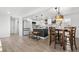 Bright, spacious kitchen with stainless steel appliances, a center island, and an inviting dining space at 5116 Jellison St, Arvada, CO 80002