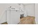 The laundry room features a washer, dryer, utility sink, and stylish flooring at 5116 Jellison St, Arvada, CO 80002