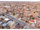 Expansive aerial view of a quiet residential neighborhood with tree-lined streets at 5116 Jellison St, Arvada, CO 80002