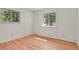 Inviting bedroom offers natural light through double windows and features beautiful hardwood floors at 9359 Barnes Ave, Conifer, CO 80433