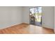 Bedroom boasts hardwood floors, natural light, and easy access to a private outdoor deck through sliding glass doors at 9359 Barnes Ave, Conifer, CO 80433