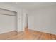 Spacious bedroom with a large closet and hardwood floors offers a comfortable and versatile living space at 9359 Barnes Ave, Conifer, CO 80433