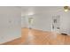 Bright living room features hardwood floors, fresh white paint, and ample natural light through the double-paned windows at 9359 Barnes Ave, Conifer, CO 80433