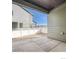 Back patio and view to the neighbors yard, as well as a tall fence providing privacy at 1296 S Algonquian, Aurora, CO 80018