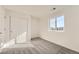 Comfortable bedroom with neutral carpet and a large window offering neighborhood views at 1296 S Algonquian, Aurora, CO 80018