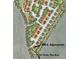 Site plan of a community showcasing street layout, homesites, and green spaces including a tee box nearby at 1296 S Algonquian, Aurora, CO 80018