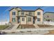 Beautiful townhome featuring a landscaped front yard and inviting entryway at 1296 S Algonquian, Aurora, CO 80018