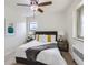 Well-lit bedroom showcasing a comfortable bed with stylish accents and wood look flooring at 2100 N Franklin St # 20, Denver, CO 80205