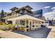 Charming vintage coffee shop with large windows and outdoor seating on a sunny day at 2100 N Franklin St # 20, Denver, CO 80205