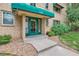 Close up of entrance at 2100 with green door and awning at 2100 N Franklin St # 20, Denver, CO 80205
