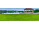 Picturesque gazebo overlooking a serene lake, set against a backdrop of lush greenery and blue skies at 2100 N Franklin St # 20, Denver, CO 80205