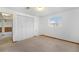 Neutral bedroom featuring carpet flooring and a large closet at 1539 S Quail St, Denver, CO 80232