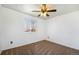 Neutral bedroom featuring a ceiling fan, and a window for natural light at 1539 S Quail St, Denver, CO 80232