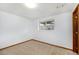 Neutral bedroom with carpet flooring and a window at 1539 S Quail St, Denver, CO 80232