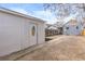 Backyard with gravel, detached garage, and wooden fence at 4442 Josephine St, Denver, CO 80216