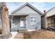 Charming craftsman bungalow with gray siding, white trim, and a welcoming front porch at 4442 Josephine St, Denver, CO 80216