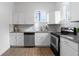 Modern kitchen with white shaker cabinets, granite countertops, and stainless steel appliances at 4442 Josephine St, Denver, CO 80216