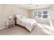 Bright bedroom with a double bed and large window at 5110 S Logan Dr, Greenwood Village, CO 80121