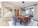 Formal dining room featuring a wooden table, light walls, and hardwood floors at 5110 S Logan Dr, Greenwood Village, CO 80121