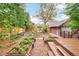 Beautiful backyard with raised garden beds and a wooden deck at 730 Cook St, Denver, CO 80206