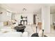 Cozy basement featuring a white sectional sofa, decor, and carpet, ideal for a comfortable living space at 730 Cook St, Denver, CO 80206