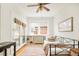 Bedroom featuring french doors, a daybed, and stylish decor, making it a cozy and inviting space at 730 Cook St, Denver, CO 80206
