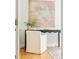 Bedroom featuring a desk, white chair, and neutral wall art, creating a serene workspace at 730 Cook St, Denver, CO 80206