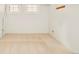Bright bedroom with two windows and neutral carpet flooring at 730 Cook St, Denver, CO 80206