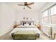Comfortable bedroom with a queen-size bed, decorative pillows, side tables and wooden floors at 730 Cook St, Denver, CO 80206