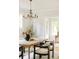 Stylish dining room with natural light, elegant table setting, and hardwood floors at 730 Cook St, Denver, CO 80206