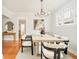 Elegant dining room with a modern table, stylish chairs, and a decorative chandelier at 730 Cook St, Denver, CO 80206