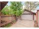 Garage with a basketball hoop and a wooden fence surrounding the property at 730 Cook St, Denver, CO 80206