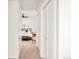 Hallway showing multiple closets and doorway into the bedroom, providing ample storage and access at 730 Cook St, Denver, CO 80206