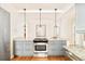 Modern kitchen with granite countertops, center island, and stainless steel appliances at 730 Cook St, Denver, CO 80206