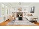 Bright living room featuring hardwood floors, fireplace, and stylish decor at 730 Cook St, Denver, CO 80206