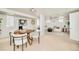 Spacious living room with wood paneling, a seating area and a table set with seating for four at 730 Cook St, Denver, CO 80206