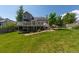 Large backyard with a spacious deck, beautiful landscaping, and a well-maintained lawn, ideal for outdoor living at 1881 Alma Ln, Superior, CO 80027