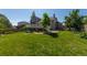 Expansive green backyard with a well-maintained lawn, complemented by a charming deck and lush trees, perfect for outdoor enjoyment at 1881 Alma Ln, Superior, CO 80027
