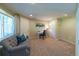 Bright and welcoming basement space, ideal for a home office or study area with comfortable seating at 1881 Alma Ln, Superior, CO 80027