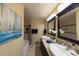Stylish bathroom with double sinks, tiled shower and bathtub at 1881 Alma Ln, Superior, CO 80027